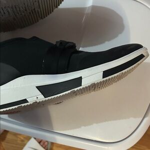 Stylish Black womens athletic Shoes slip on FITFLOPS.  small glue spot on sole